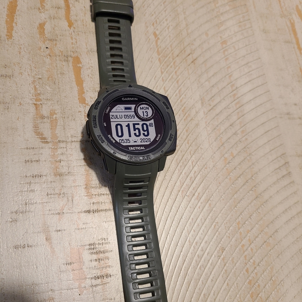 Garmin instinct solar watch with charger